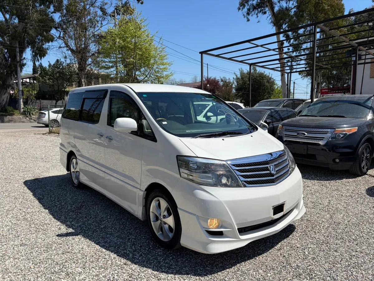 Toyota Alphard белый — фото 1